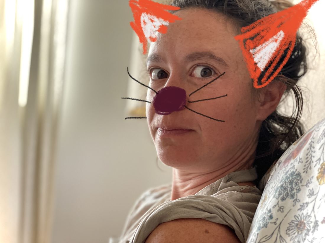 Stef with drawn-on woodland-creature ears, nose, and whiskers